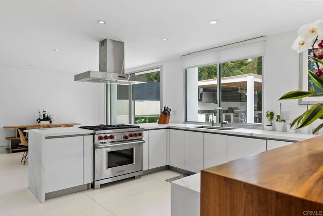 a kitchen with a stove and a sink