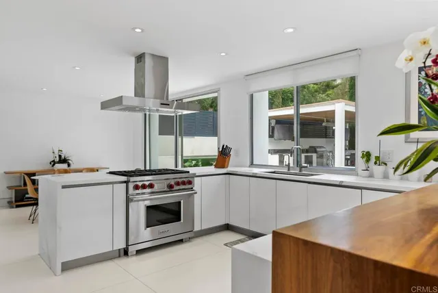 a kitchen with a stove and a sink
