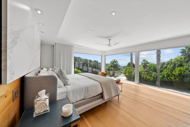 a bed room with a bed and a window