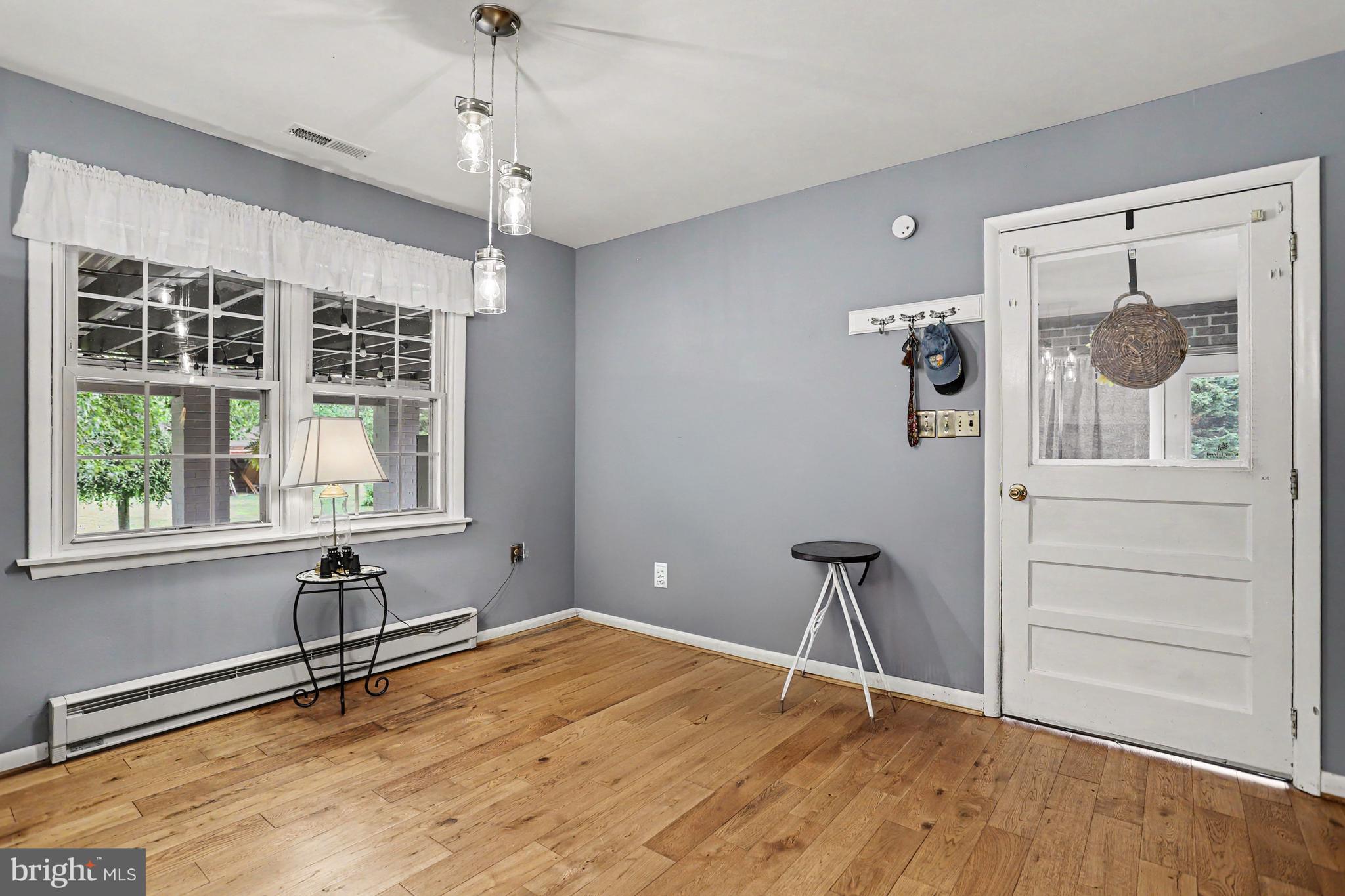 2226 Harney Road Littlestown, PA 17340 - Photo 11 of 40 a view of a livingroom with a window and wooden floor