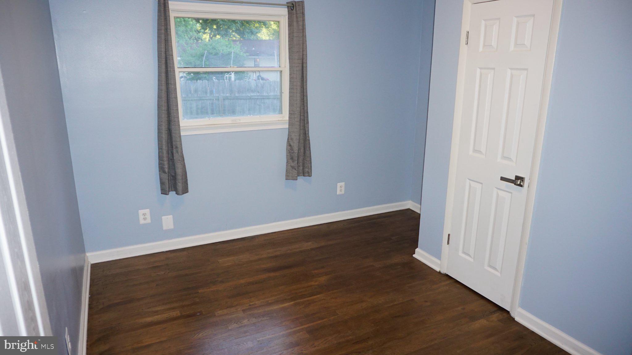 5854 Deale Churchton Road Deale, MD 20751 - Photo 39 of 57 Bright and airy room with blue walls.