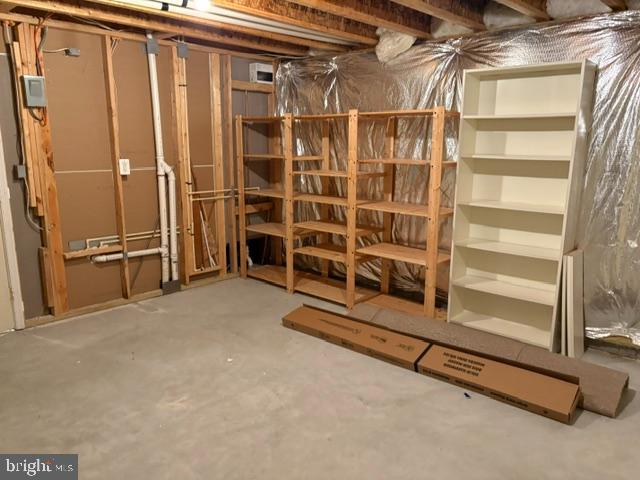 5870 Deer Ridge Lane Elkridge, MD 21075 - Photo 48 of 55 Unfinished area in lower level, shelves convey