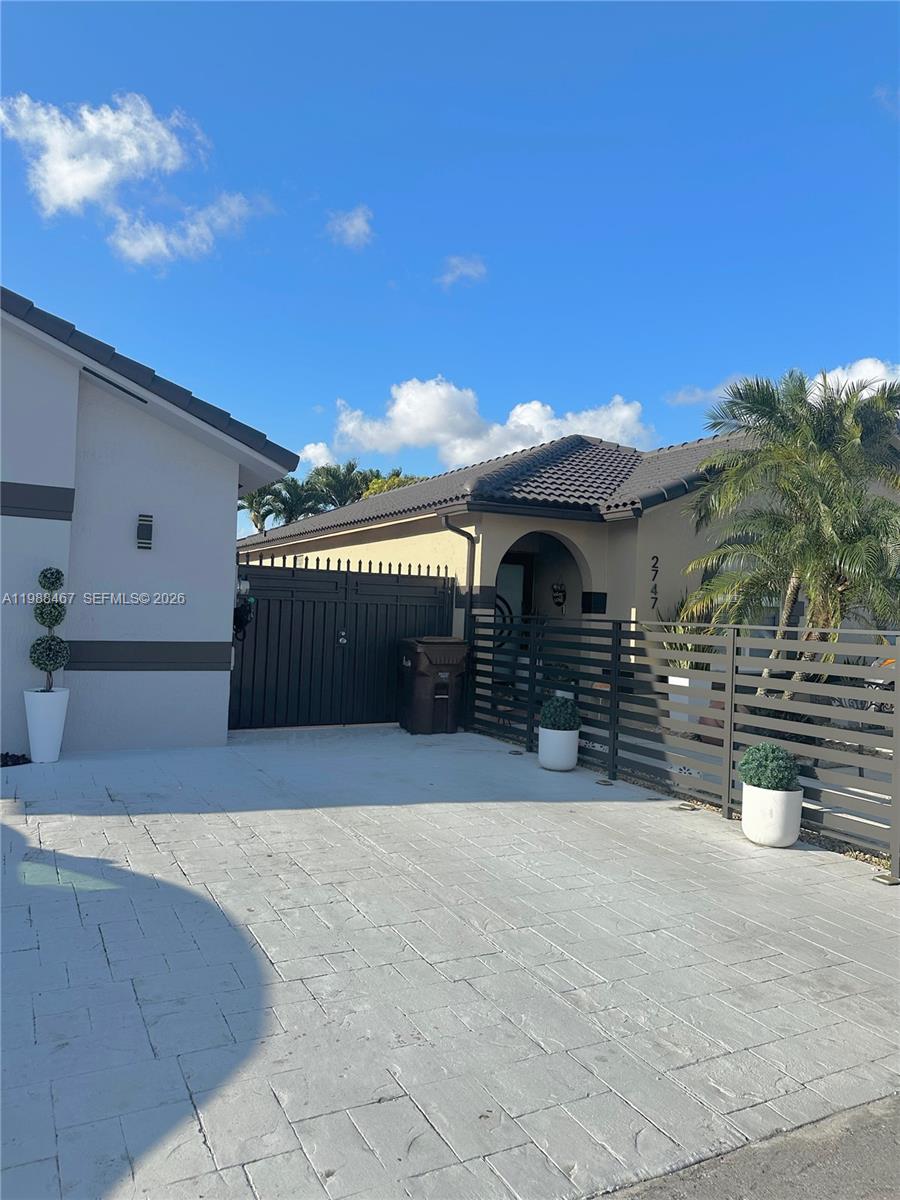 2753 West 68th Place, Unit 1 Hialeah, FL 33016 - Photo 1 of 13 a view of outdoor space and yard