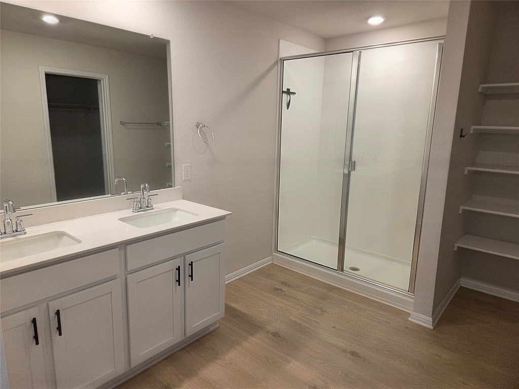 2421 Corriente Path Leander, TX 78641 - Photo 6 of 19 a bathroom with a shower sink and mirror