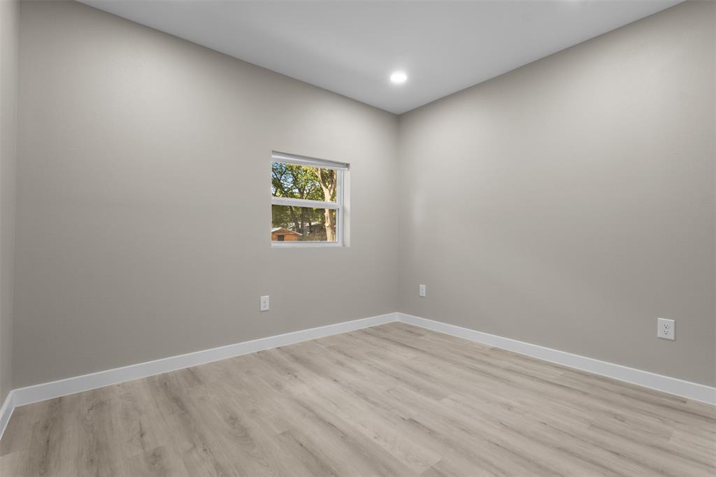 1903 Beauford Road Dallas, TX 75253 - Photo 20 of 27 Recessed ceiling lighting, light gray wall finish, wood-finish flooring, white window trim, and white baseboards