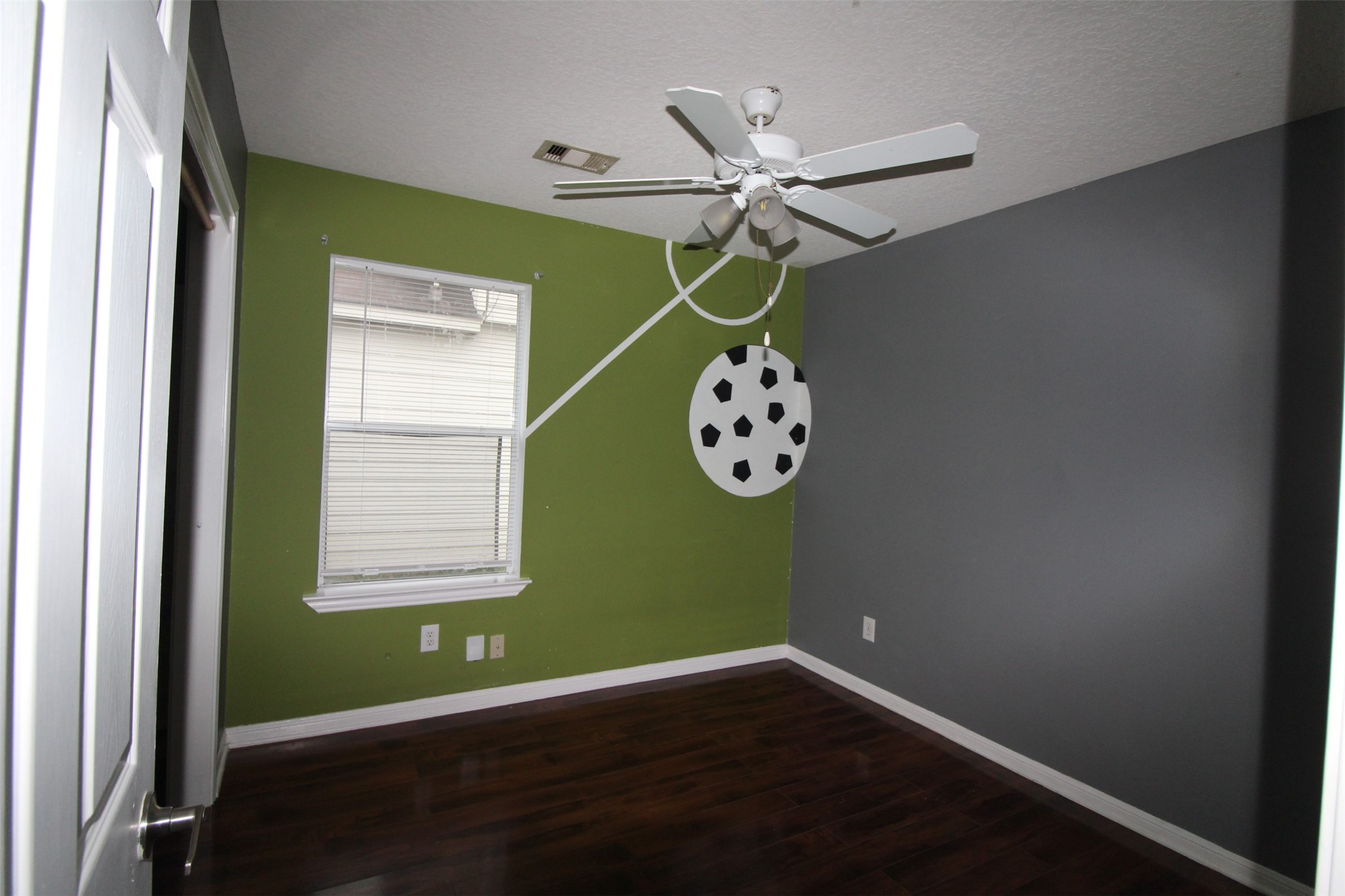 19614 Oleander Ridge Way Cypress, TX 77433 - Photo 11 of 13 an empty room with a window and a fan