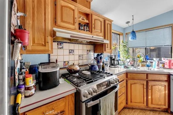 a kitchen with a stove and a sink