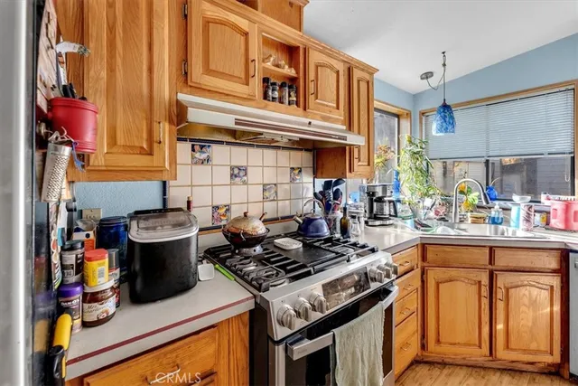 a kitchen with a stove and a sink