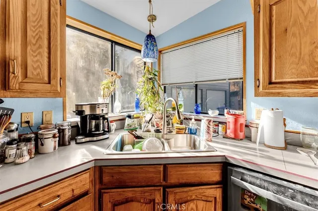 a large dining space with furniture window and wooden floor