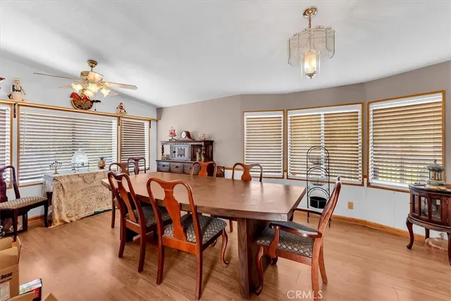 a view of a dining room with furniture and window