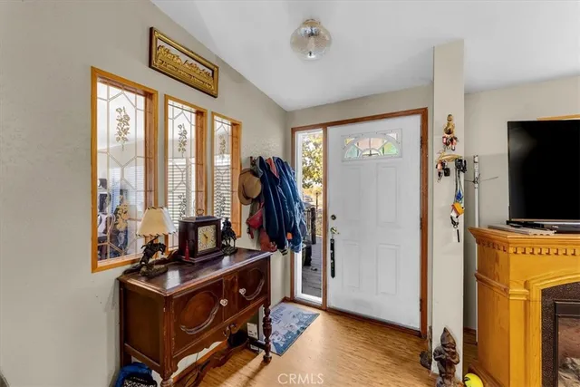 a view of a workspace with furniture and a flat screen tv