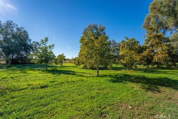 a view of a house with swimming pool and sitting area