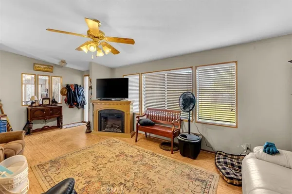 a living room with furniture flat screen tv and a fireplace