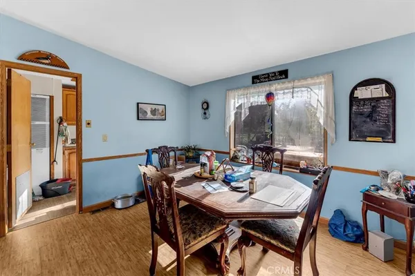 a view of a dining room with furniture and window