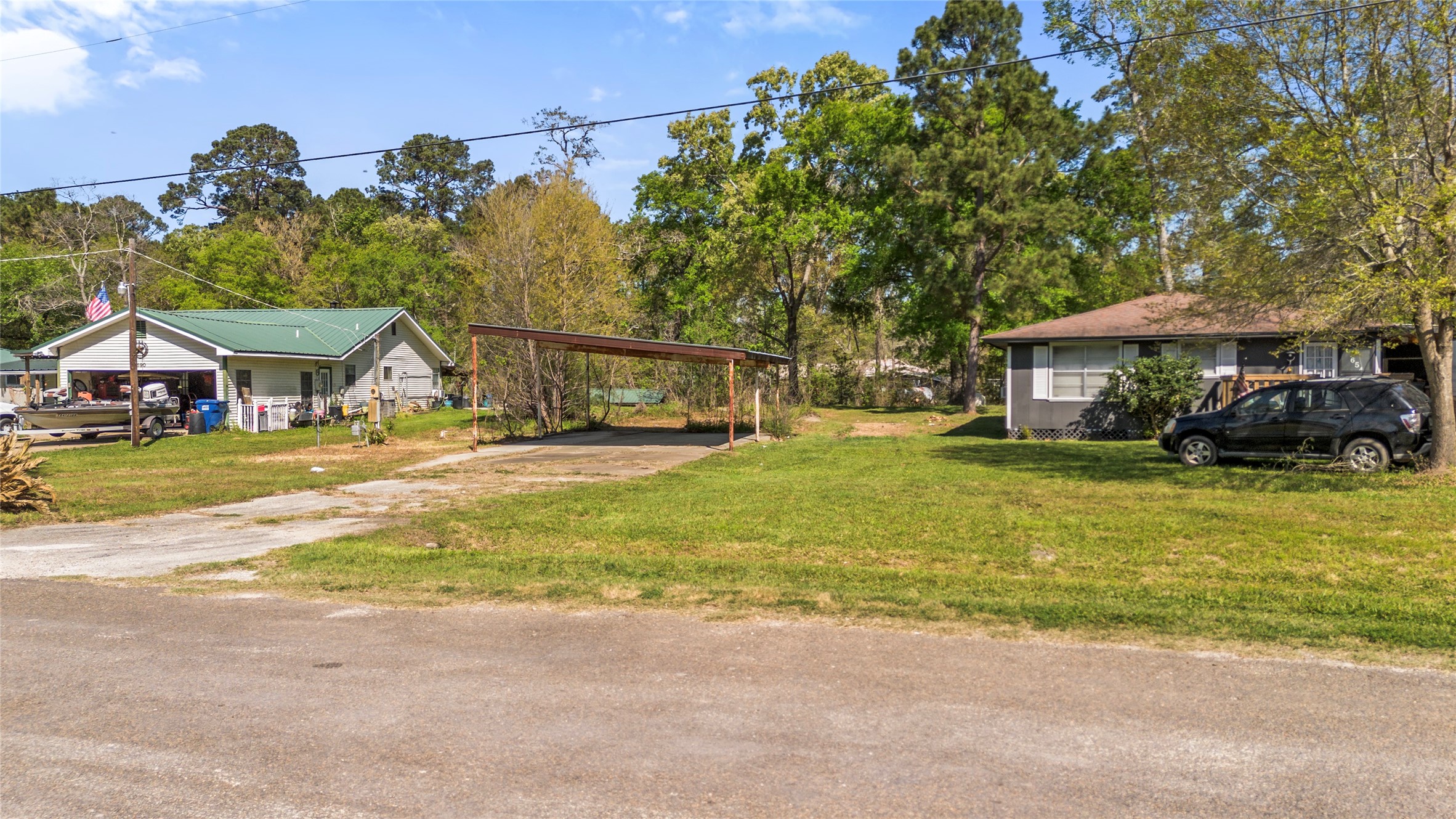 662 Tallow Street Onalaska, TX 77360 - Photo 2 of 8 a view of a house with a swimming pool