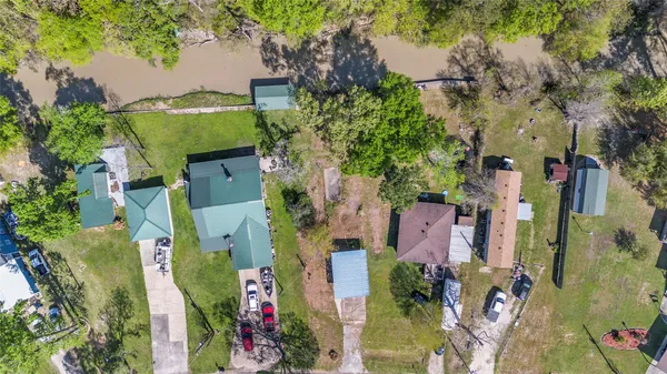 an aerial view of residential houses with outdoor space