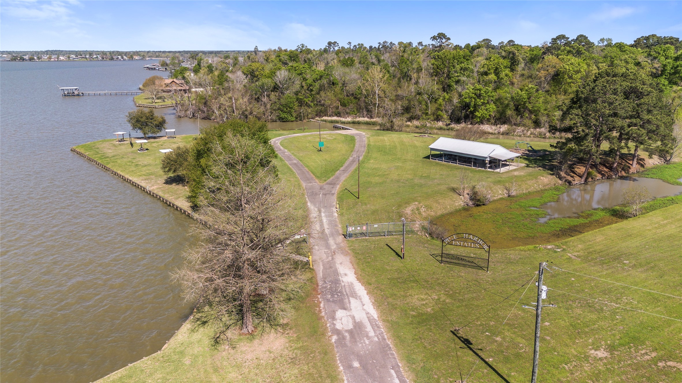 662 Tallow Street Onalaska, TX 77360 - Photo 7 of 8 a view of a swimming pool with a yard