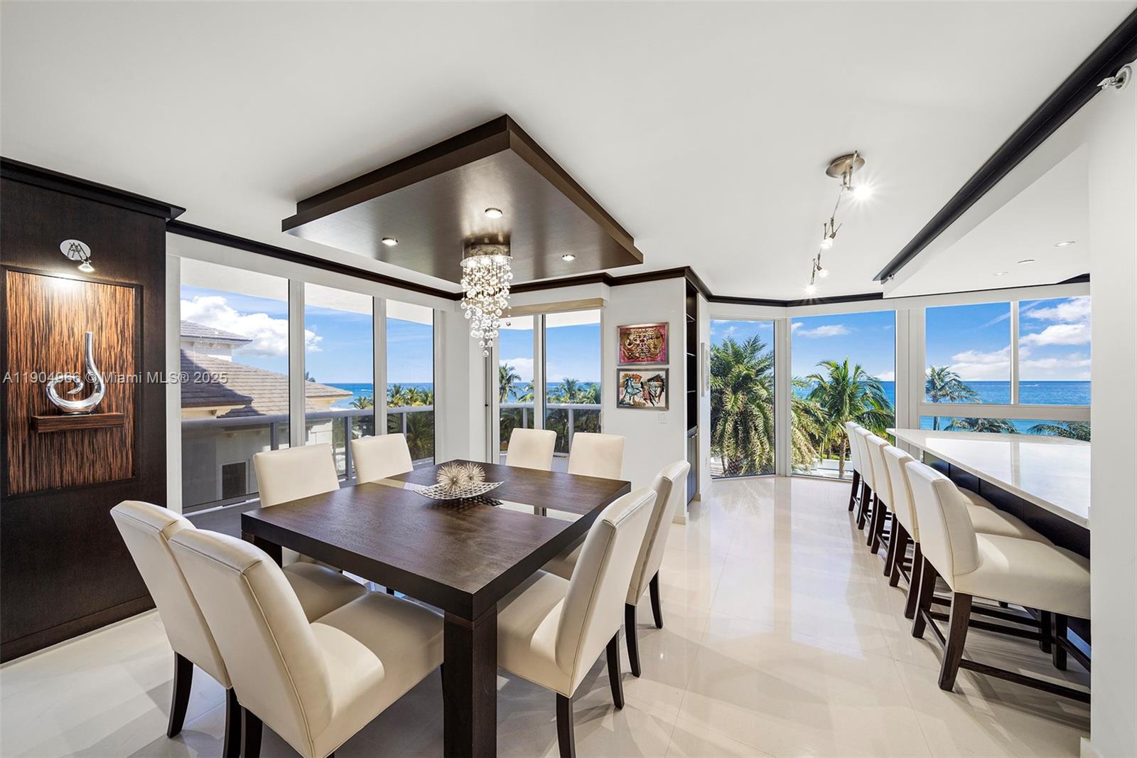 4775 Collins Avenue, Unit 501 Miami Beach, FL 33140 - Photo 3 of 60 a living room with furniture and a large window