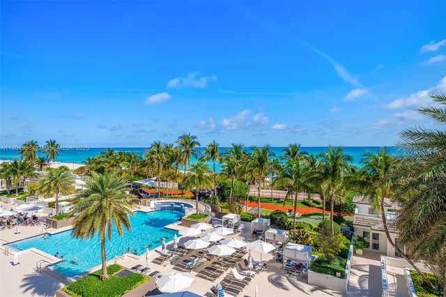 a kitchen with stainless steel appliances a stove a refrigerator a sink and a counter