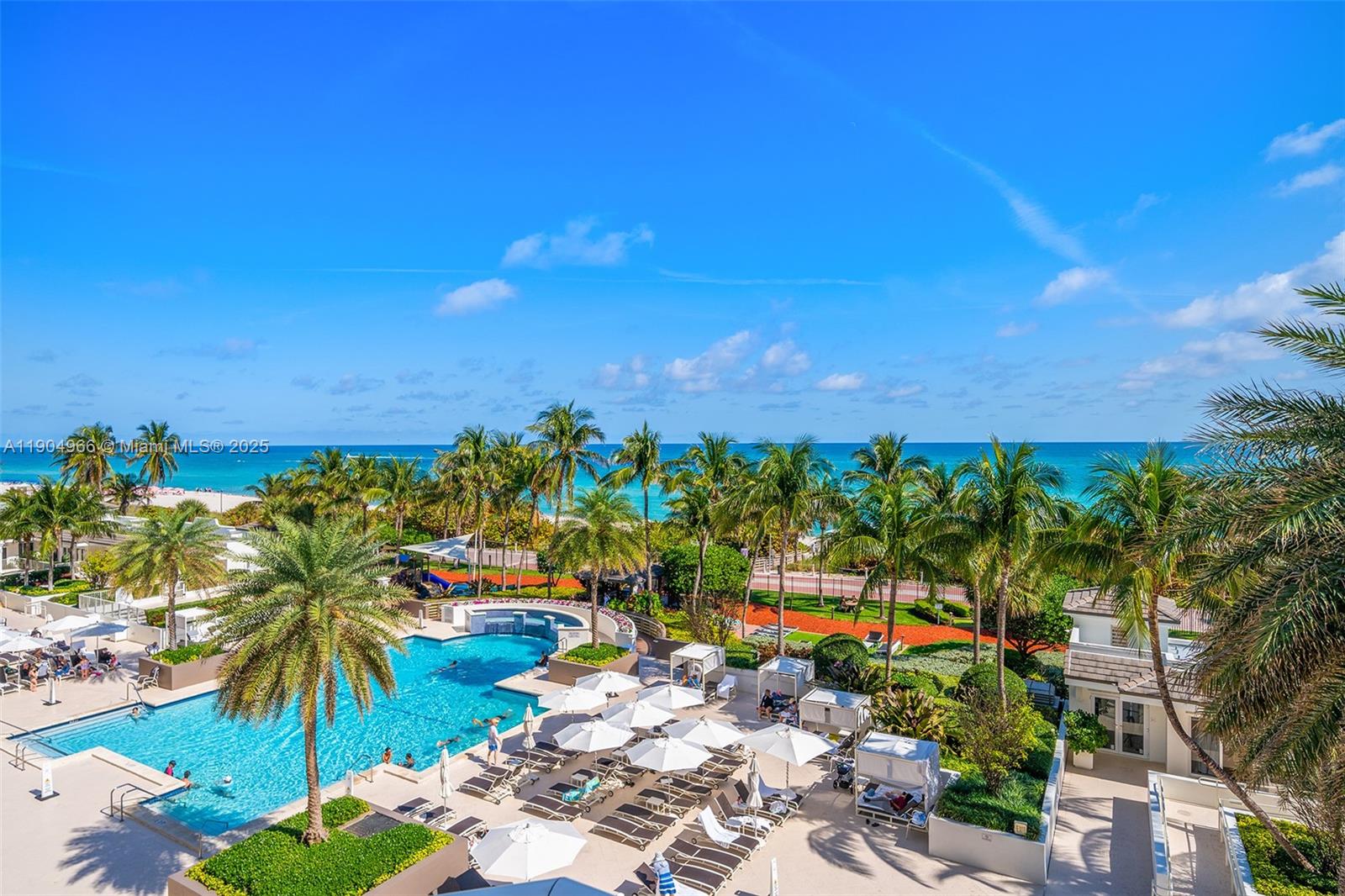 4775 Collins Avenue, Unit 501 Miami Beach, FL 33140 - Photo 34 of 60 a view of a swimming pool with an outdoor space and seating area