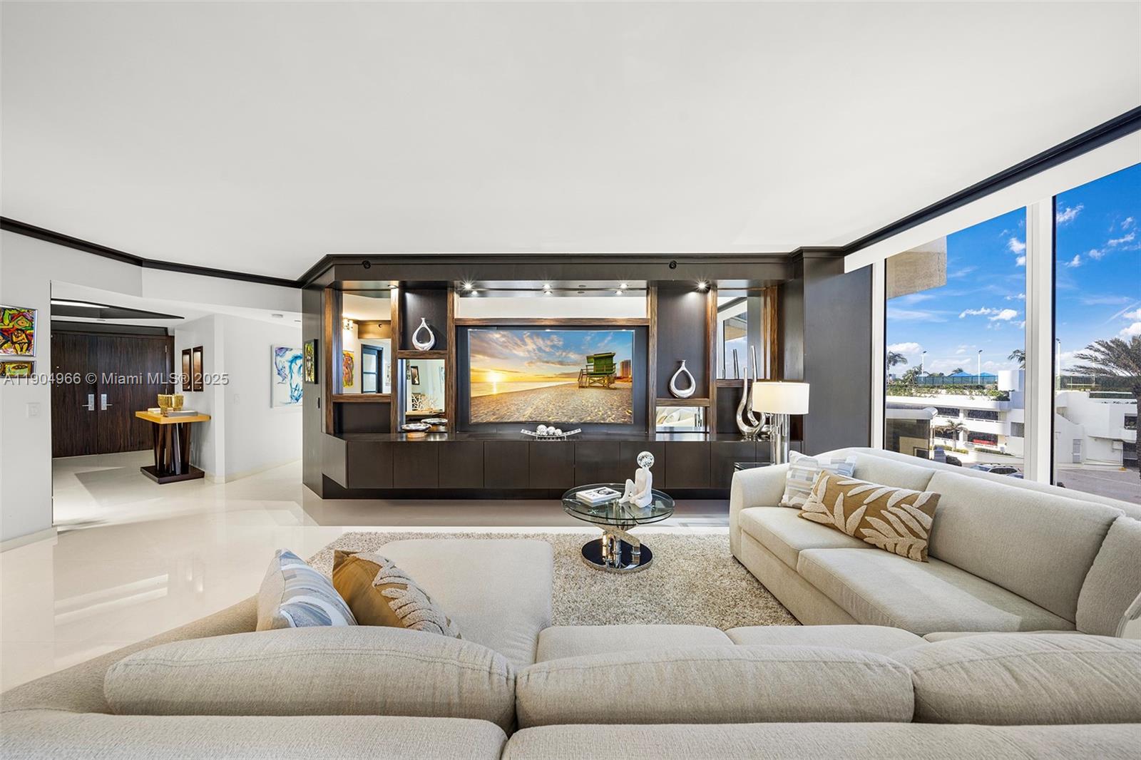 4775 Collins Avenue, Unit 501 Miami Beach, FL 33140 - Photo 7 of 60 a living room with furniture and a large window