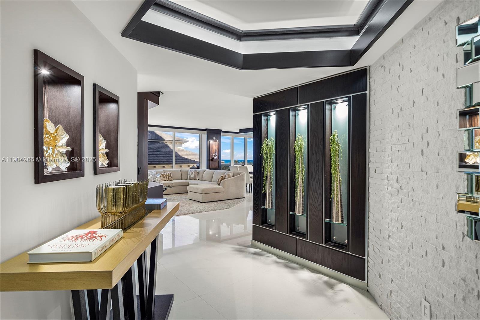 4775 Collins Avenue, Unit 501 Miami Beach, FL 33140 - Photo 8 of 60 a living room with furniture