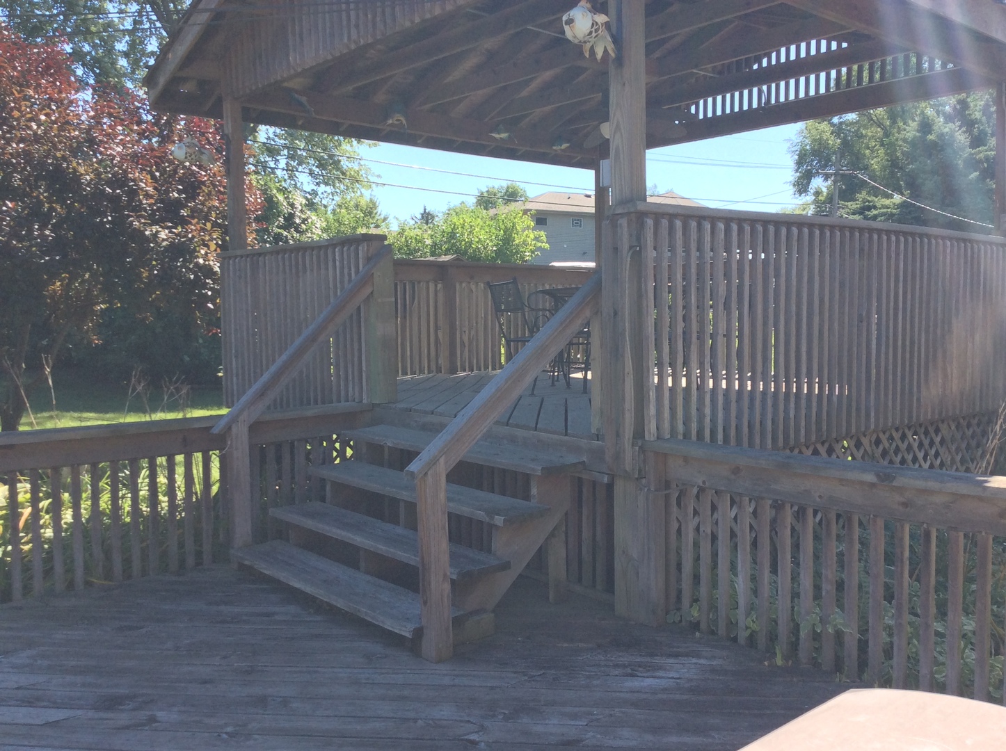 5909 107th Street Chicago Ridge, IL 60415 - Photo 31 of 32 a view of a deck with wooden floor and fence