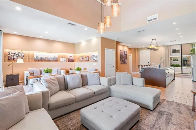 a view of a hallway to rooms and stairs