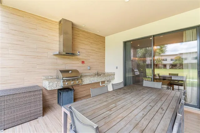 a view of a patio with swimming pool table and chairs