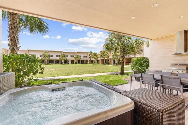 a view of a swimming pool with a patio