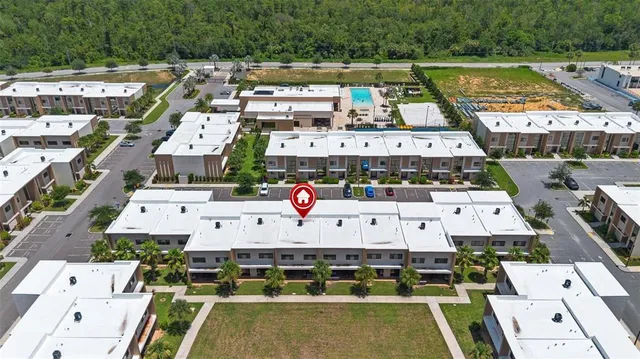a view of a swimming pool with outdoor seating