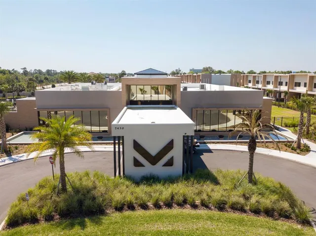 a view of a bench in the front view of a house