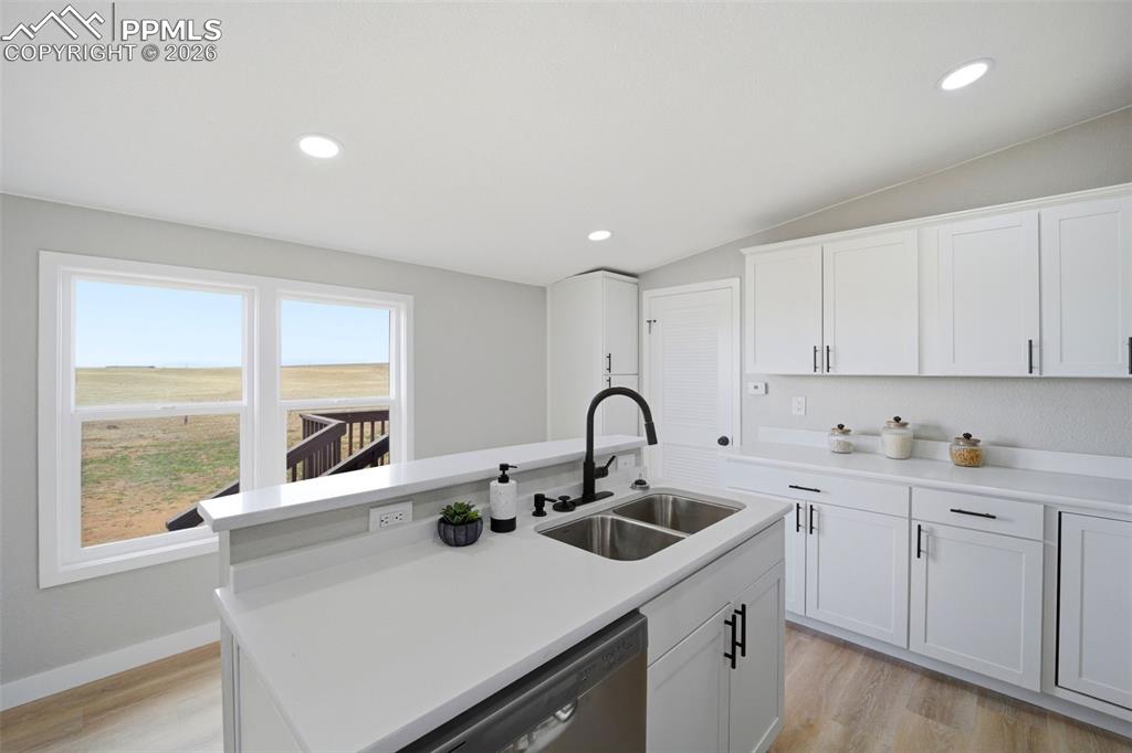 35125 Book Road Yoder, CO 80864 - Photo 23 of 45 a kitchen with a sink cabinets and a window