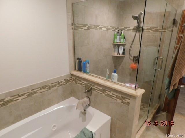 9482 Stelzer Road Howell, MI 48855 - Photo 17 of 28 Master bathroom