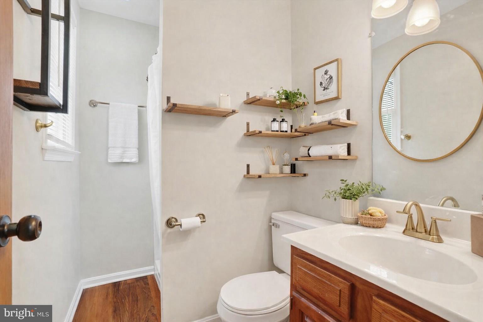 11 Dogwood Lane Manchester, PA 17345 - Photo 11 of 23 a bathroom with a sink vanity mirror and toilet