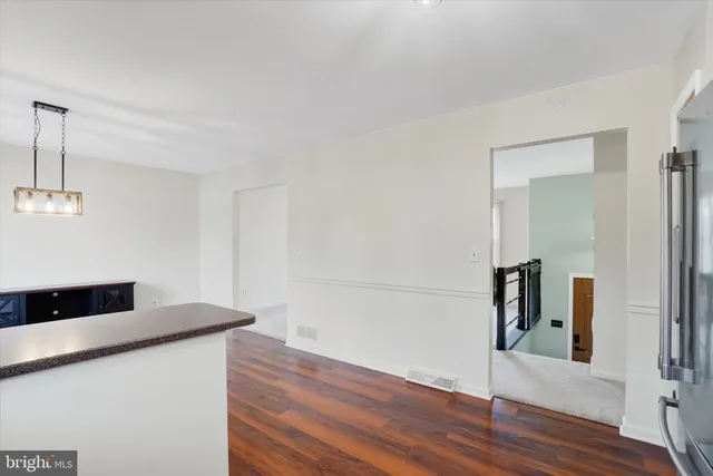 a bathroom with a sink toilet vanity and shower