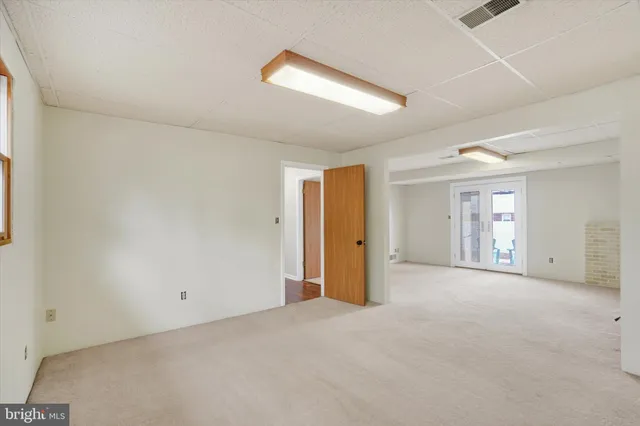 a view of a house with a yard and garage
