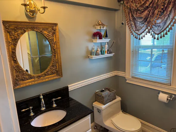 a bathroom with a glass shower door