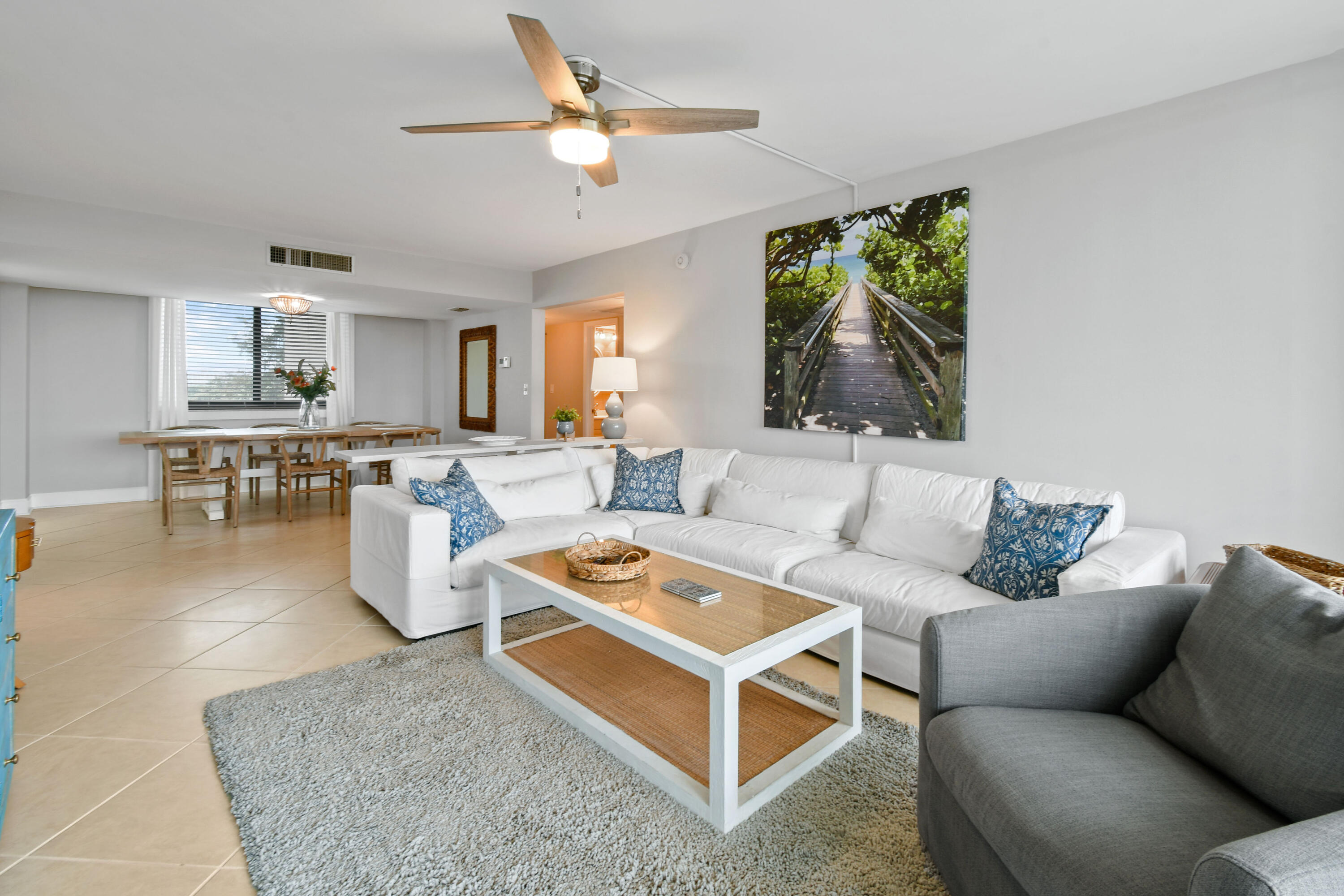 1605 Highway 1, Unit M1404 Jupiter, FL 33477 - Photo 12 of 42 a living room with furniture and a large window