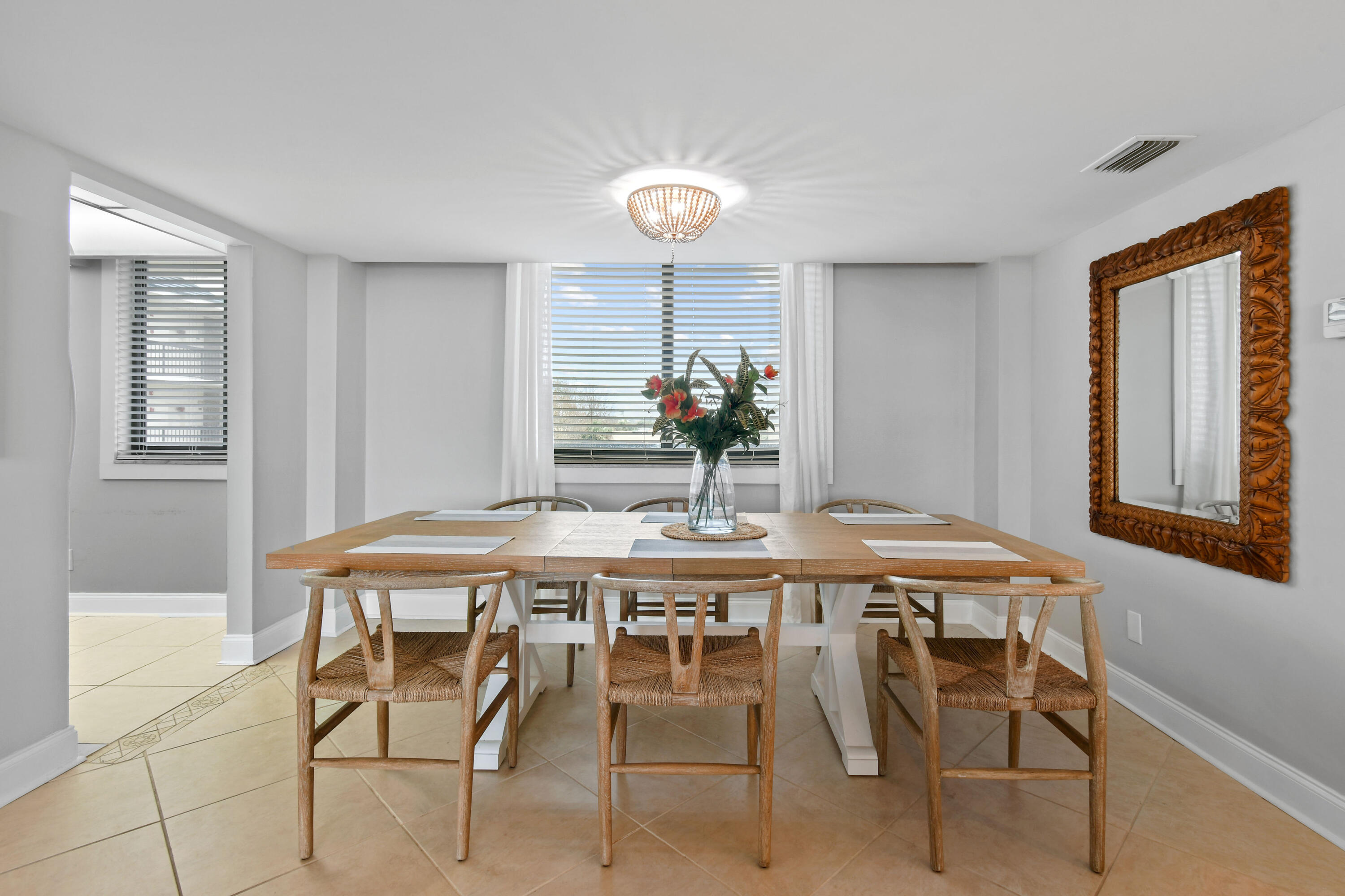 1605 Highway 1, Unit M1404 Jupiter, FL 33477 - Photo 13 of 42 a dining room with a table and chairs