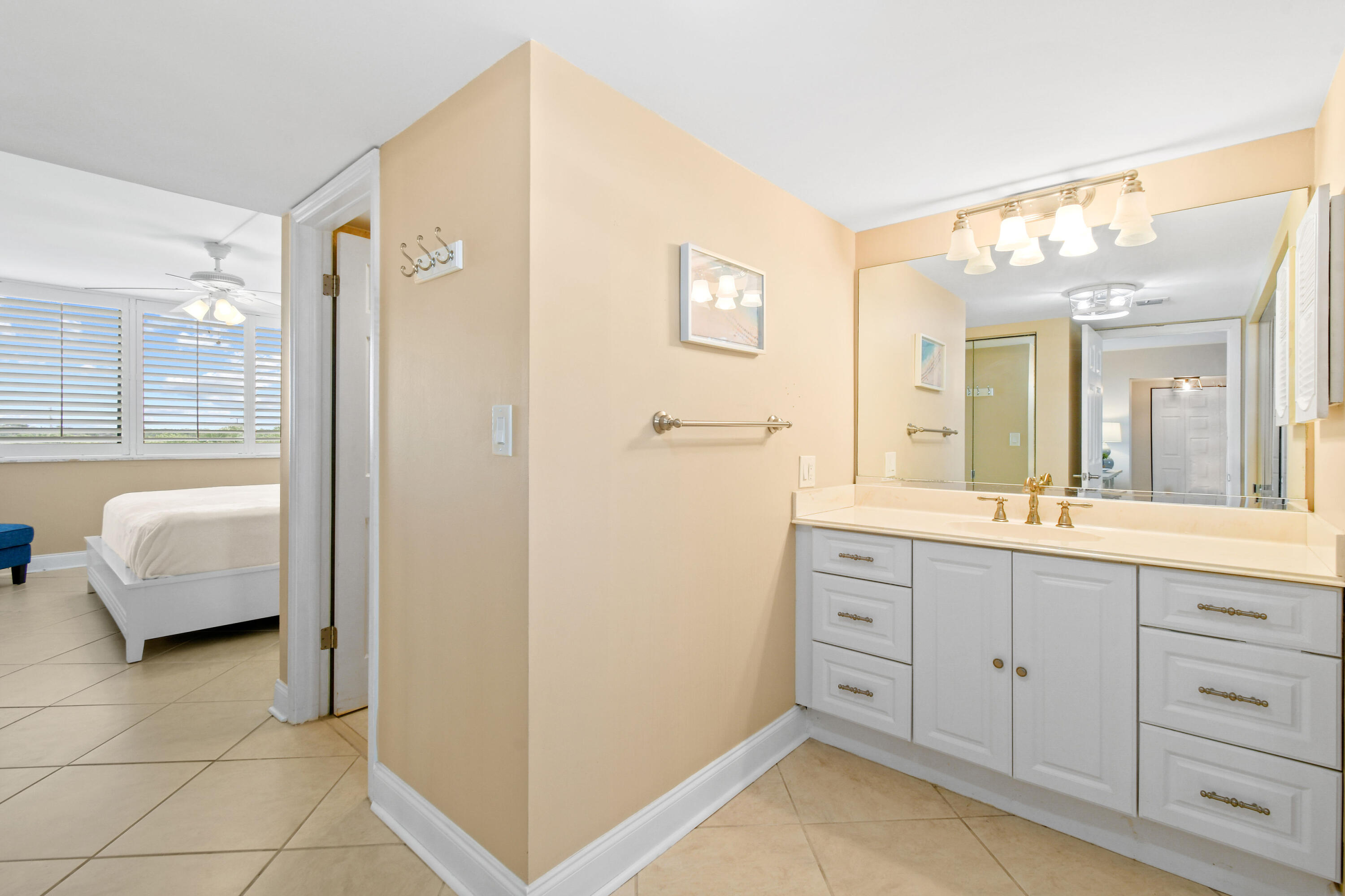 1605 Highway 1, Unit M1404 Jupiter, FL 33477 - Photo 20 of 42 a spacious bathroom with a double vanity sink a mirror and a shower
