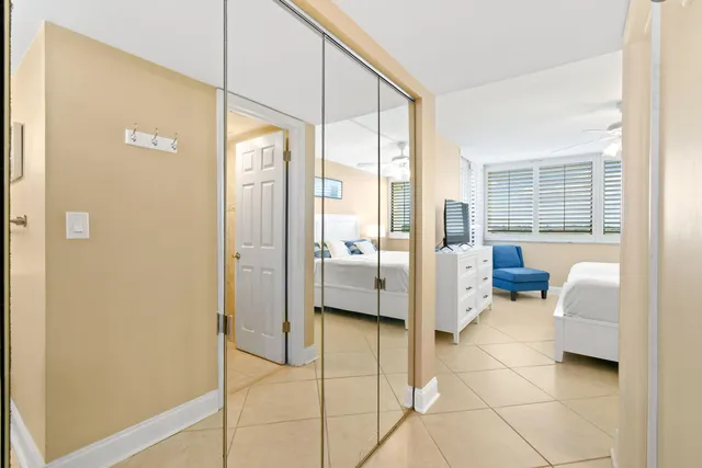 a bedroom with a bed and a couch