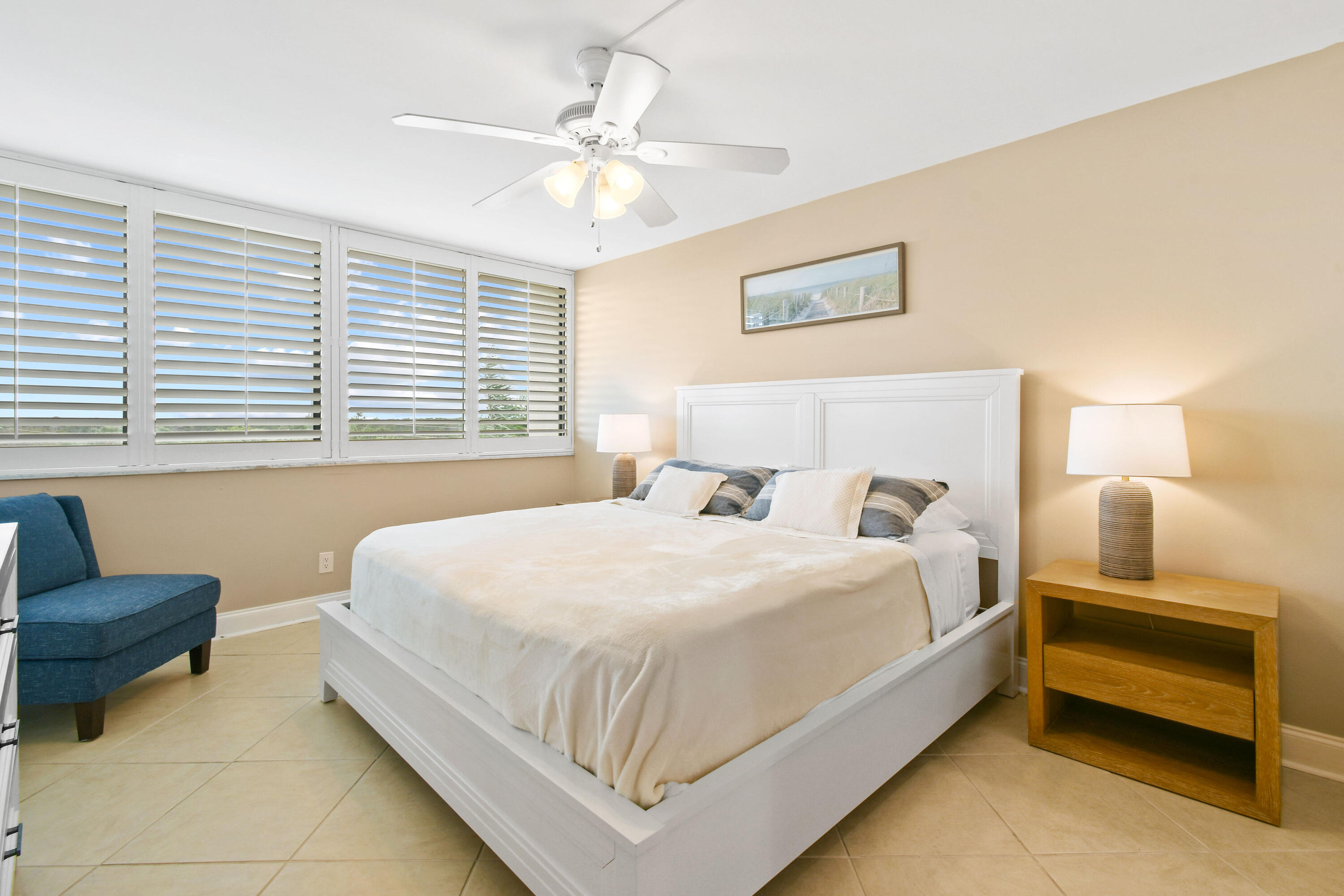 1605 Highway 1, Unit M1404 Jupiter, FL 33477 - Photo 23 of 42 a bedroom with a bed and a couch