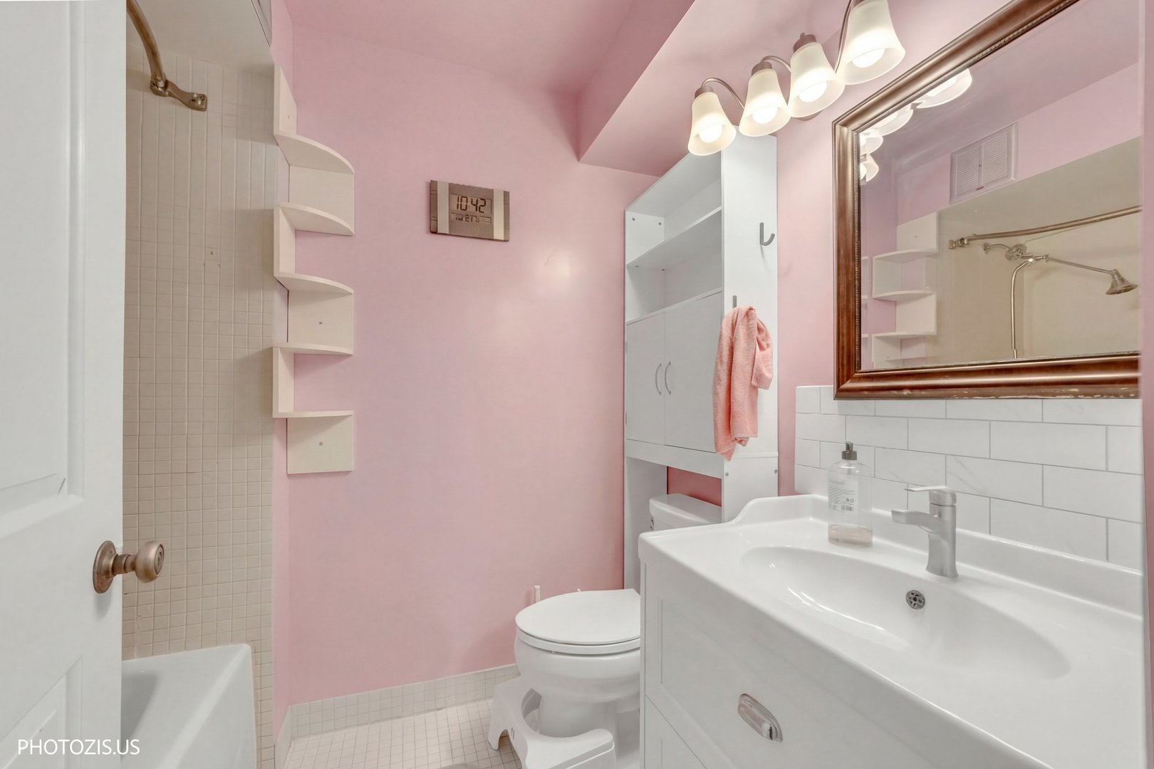 1621 Mission Hills Road, Unit 108 Northbrook, IL 60062 - Photo 9 of 22 a bathroom with a sink a toilet a mirror and shower