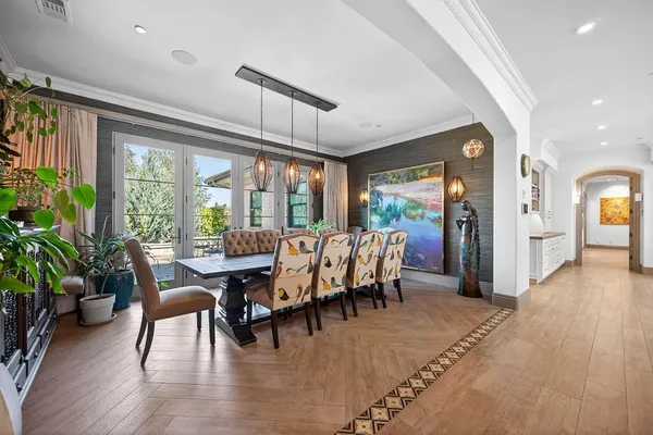 a kitchen with stainless steel appliances a sink stove and cabinets