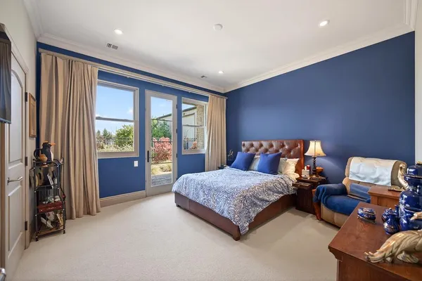 a view of a garden with a building in the background