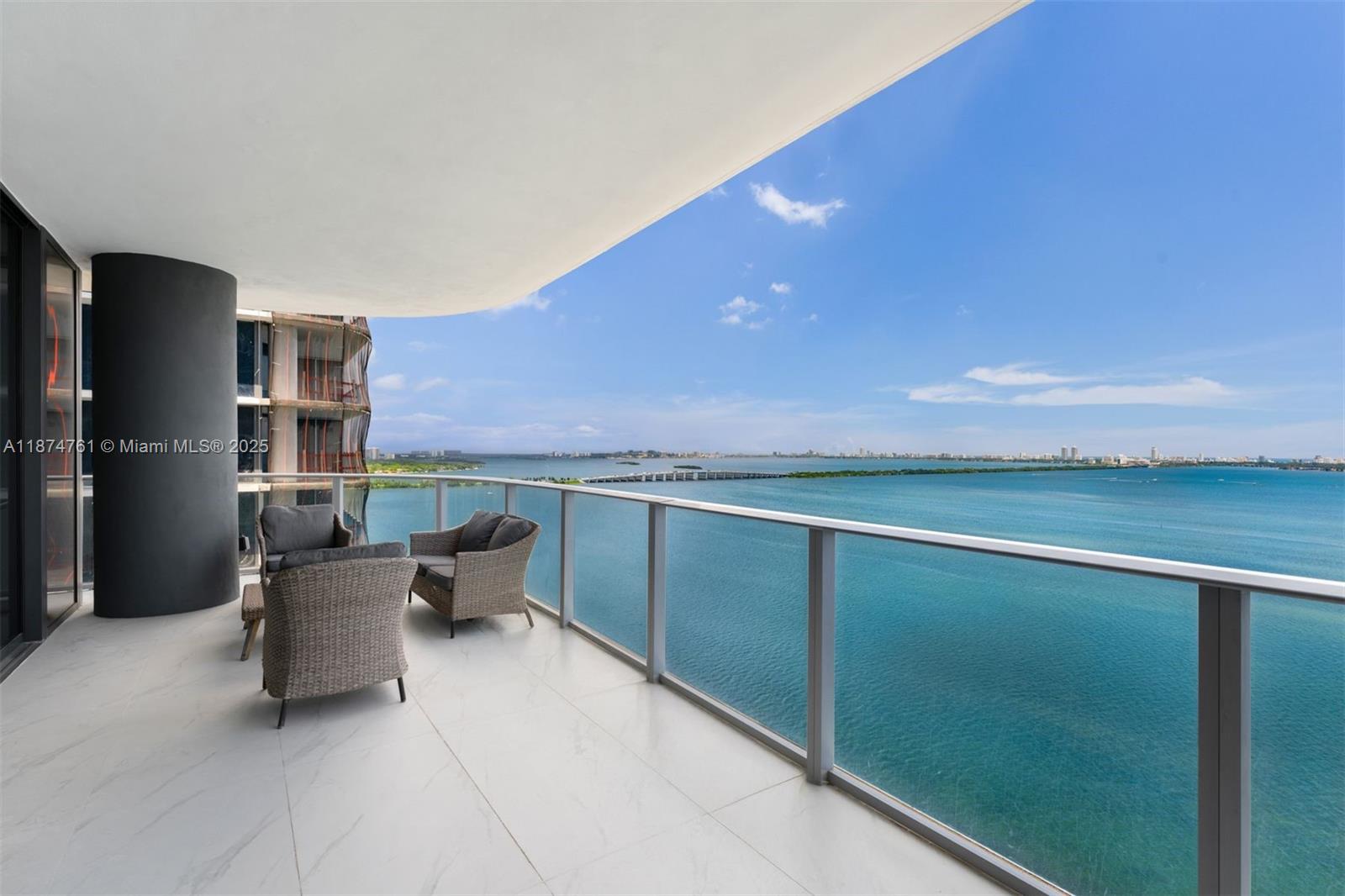 700 Northeast 24th Street, Unit 2201 Miami, FL 33137 - Photo 6 of 20 a terrace with a table and chairs