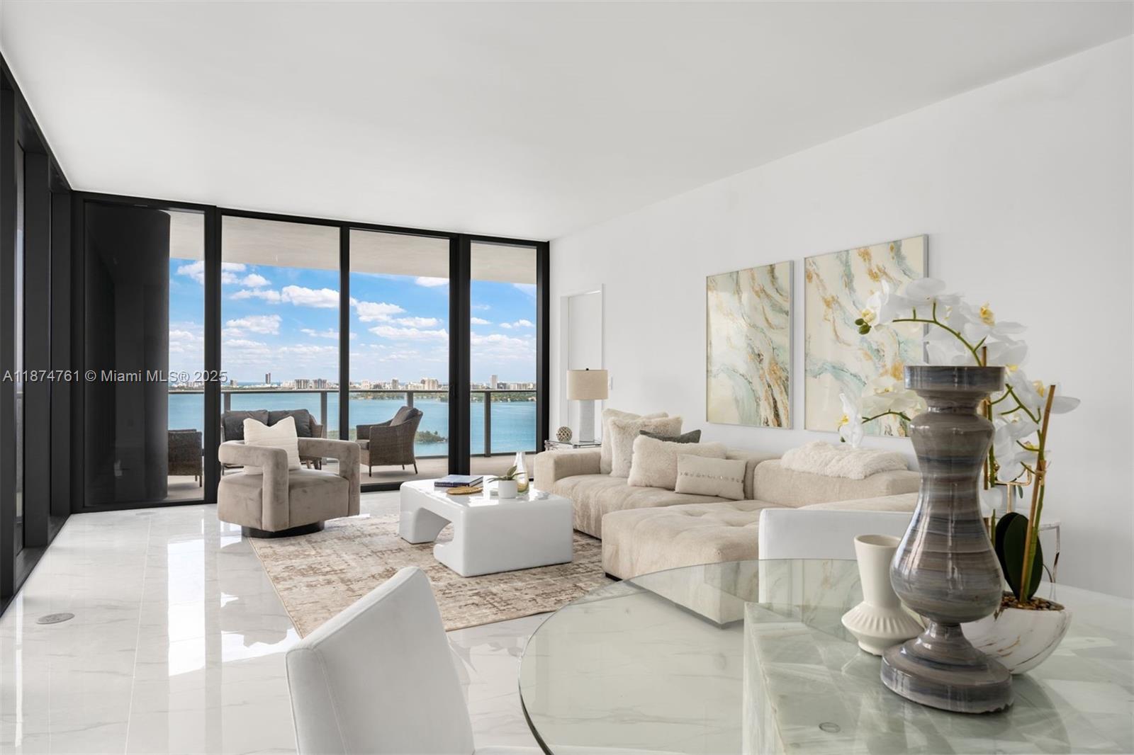 700 Northeast 24th Street, Unit 2201 Miami, FL 33137 - Photo 9 of 20 a living room with furniture and a floor to ceiling window