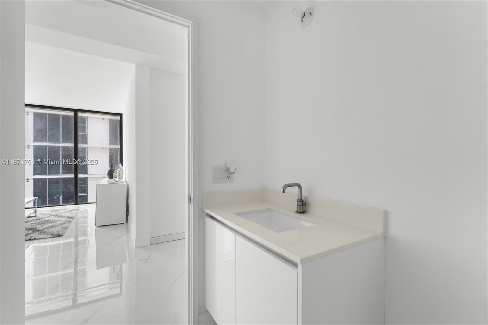 700 Northeast 24th Street, Unit 2201 Miami, FL 33137 - Photo 10 of 20 a bathroom with a sink and vanity