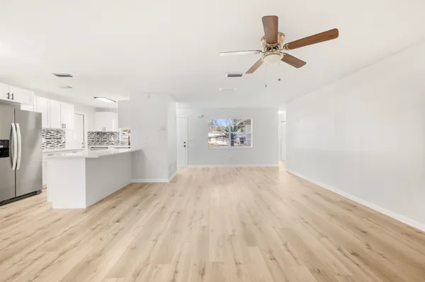 a view of a kitchen with electric appliances